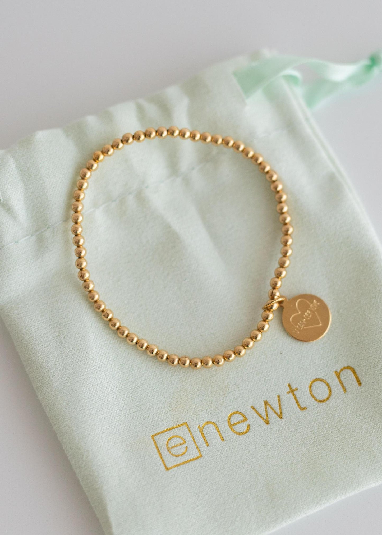 enewton Gold Charm Bracelet